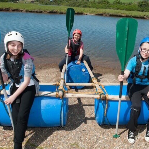 Kids aboard their raft