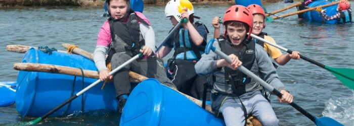 Kids sailing on their rafts