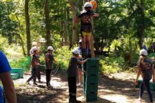 group of children participating in crate stacking challenge